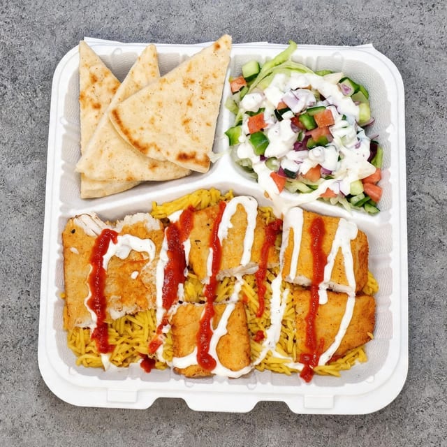 Fish Over Rice with Salad and Can Soda.