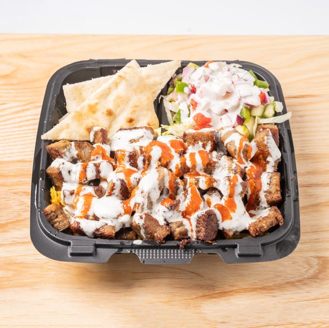 Lamb Over Rice with Salad and Can Soda.