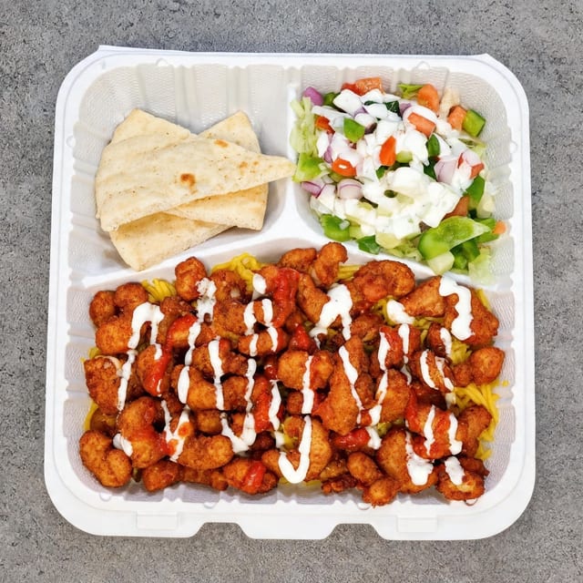 Shrimp Basket Over Rice with Salad and Can Soda.