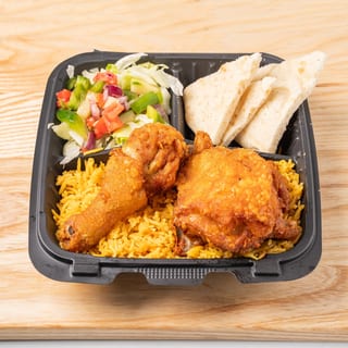 Fried Chicken Over Rice with Salad and Can Soda