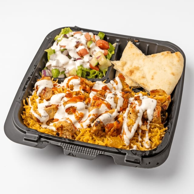 Chicken Over Rice with Salad and Can Soda.